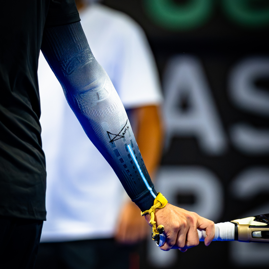 Close-up of Agustín Tapia wearing the NO STRAIN Evolution biomechanical sleeve